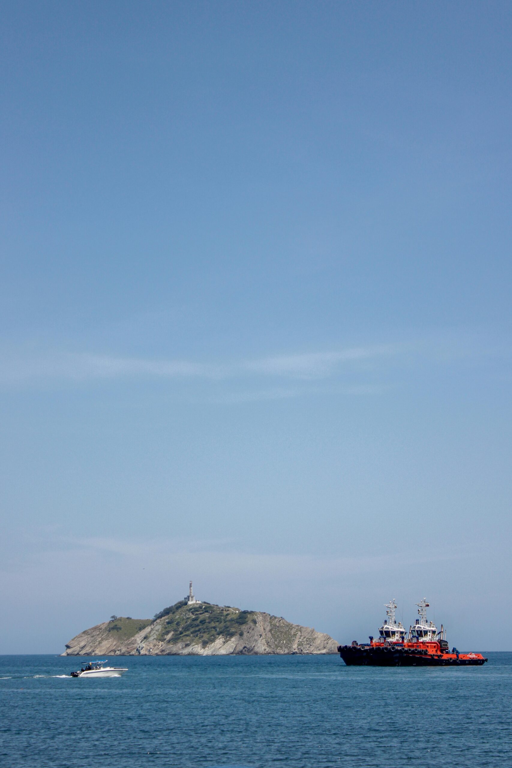 Scenic view of boats near Isla del Morro under a clear blue sky in Santa Marta, Colombia.